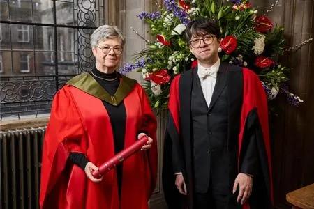 Dr Frances Westall accepting their honorary degree.