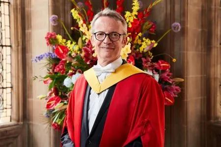 Professor Luc Sels receiving their honorary degree.