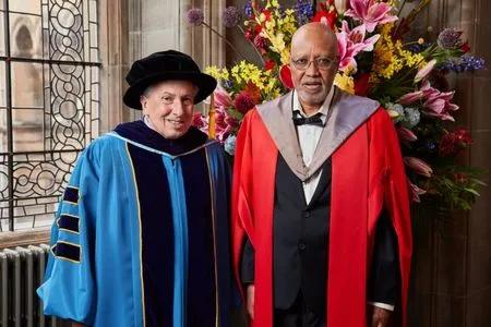 Professor Sinfree Bullock Makon receiving their honorary degree.