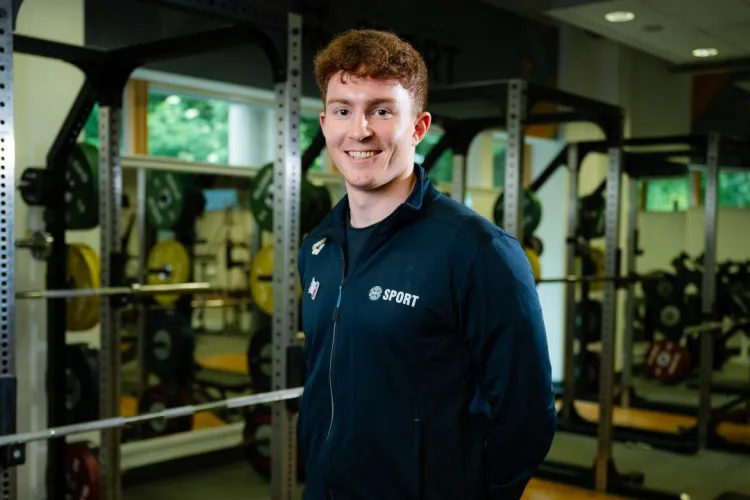 Swimmer Archie Goodburn poses in the University gym