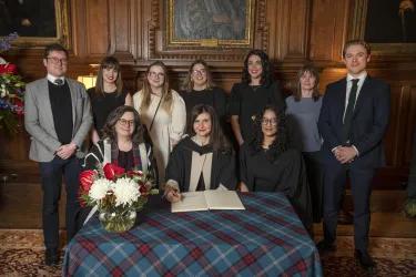 Dora Handrea receiving the Principal's Medal on behalf of Edinburgh Innovations Student Enterprise Team