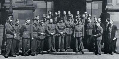 Teaching staff and graduates after the graduation ceremony in the McEwan Hall, July 1942.