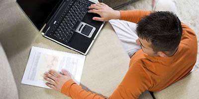 Student using laptop to access online course