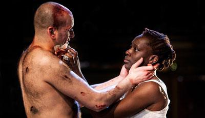 Photo of Ricky Champ as Josef the Fool (left) and Ony Uhiara as Lizaveta in Cannibals