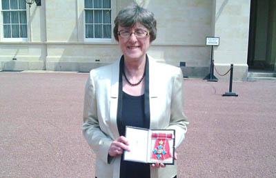 Frances Dow receives a CBE at Buckingham Palace