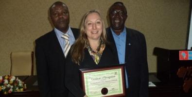 Sue welburn receiving award for SOS campaign