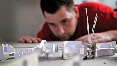 Architecture student working with scale models