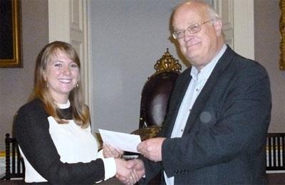 Isobel Walker receiving her prize from Prof Timothy Champion