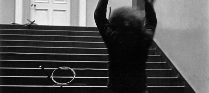 Stefan Wewerka’s ‘Bentwood Chair Action’ on the grand staircase with Klaus Rinke smashing chair (August 1970). Photo