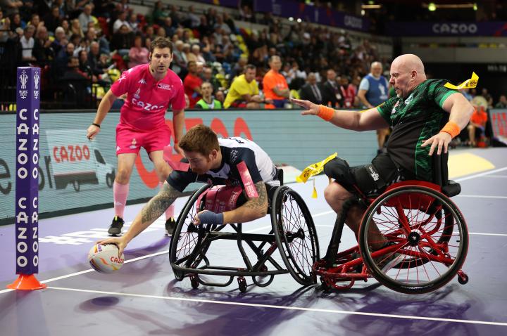 Ollie Cruikshank refereeing Wheelchair rugby world cup final, players scoring try