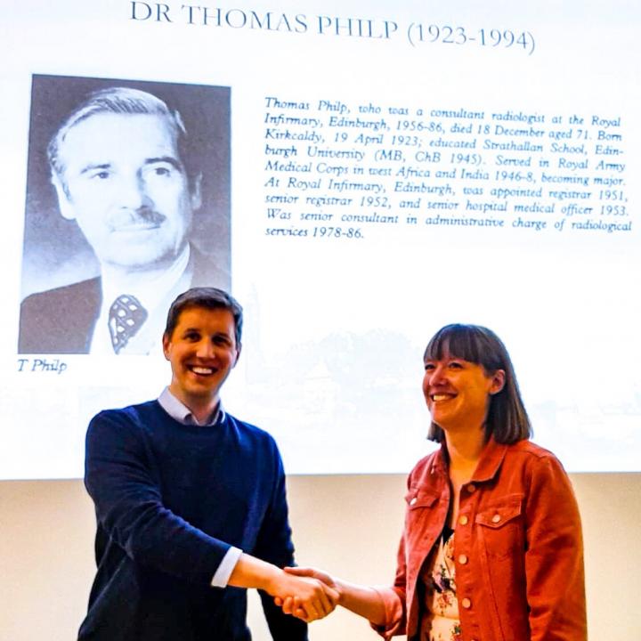 Dr Kenneeth Muir presents the 2019 Tom Philps prize to Dr Laura Middleton
