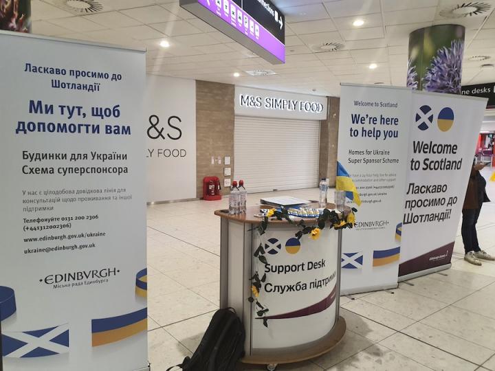 Welcome desk for Ukrainian refugees at Edinburgh Airport