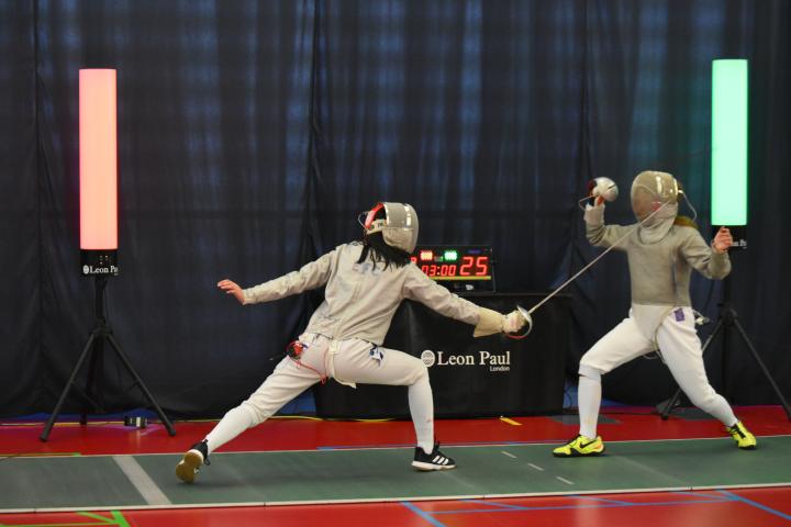Image of Edinburgh University fencer scoring against opponent