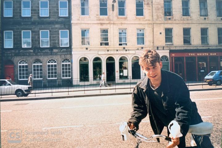 Anson Mackay riding a bike on Teviot Place in 1987