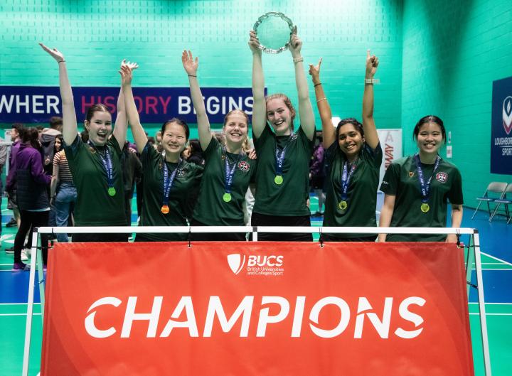 Image of Women's Badminton team lifting Trophy at BUCS Big Wednesday