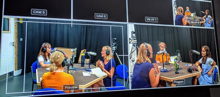 Multiple screens showing Beth and Udita's podcast episode being recorded