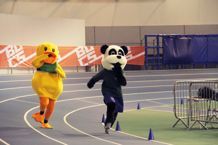 SU mascot Hector the panda running around a track