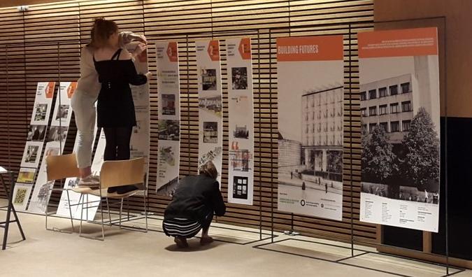 Rosie and Caitlin setting up the Building Futures exhibition
