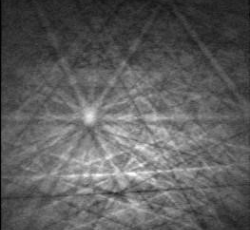 An image using Electron Backscatter Diffraction that shows aragonite needles in a speleothem surrounded by calcite 