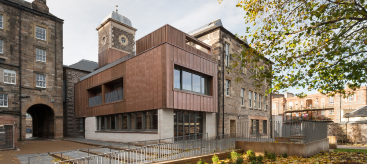 An outside view showing a modern timber and glass structure of the ECCI building