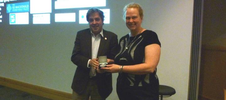 Professor Catherina Becker is presented with the 2016 Eurolife Distinguished Lecturer medal by Professor Jordi Alberch 