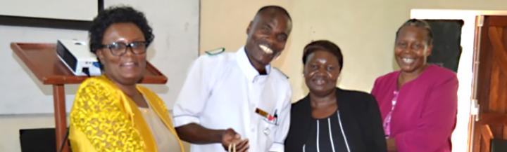 Comas Kapuyanyika receiving award as part of Compassionate Care project, Malawi