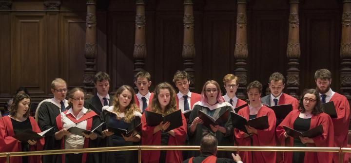 Students singing in the McEwan Hall