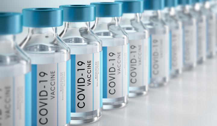 A photograph of a row of covid-19 vaccine vials