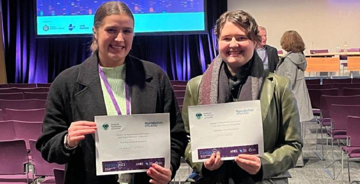 Cara and Scarlett holding their certificates at the fertility conference