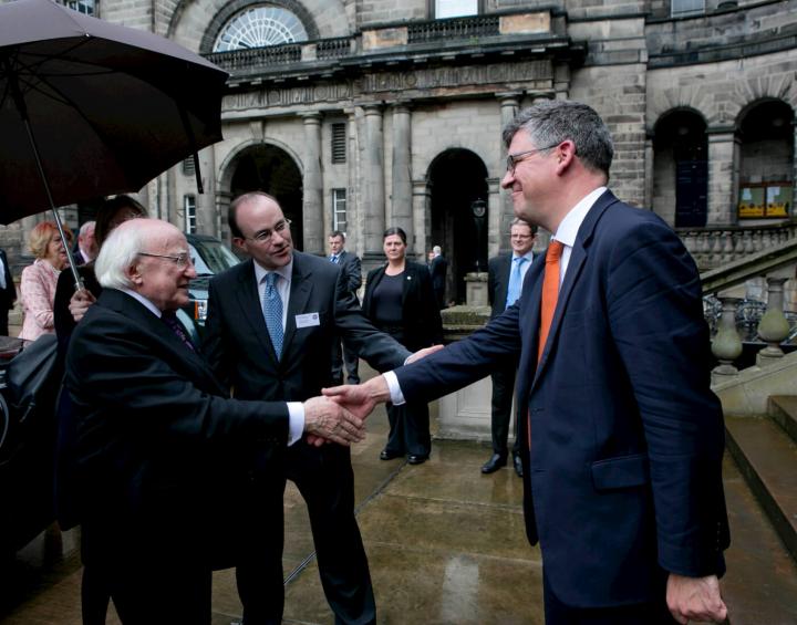 Michael D Higgins is greeted by Chris Cox