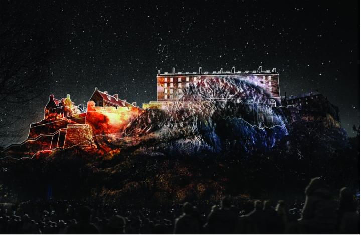 Deep Time visualisation of fossilised creatures projected onto Edinburgh Castle rock