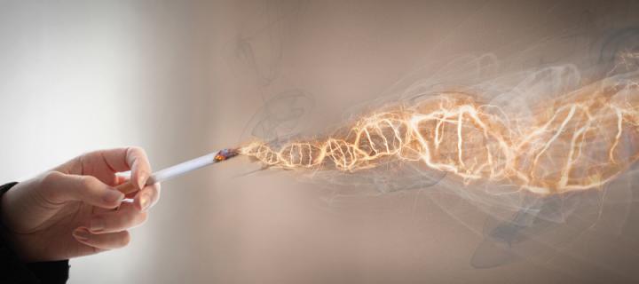 Hand holding cigarette with smoke forming in the shape of DNA