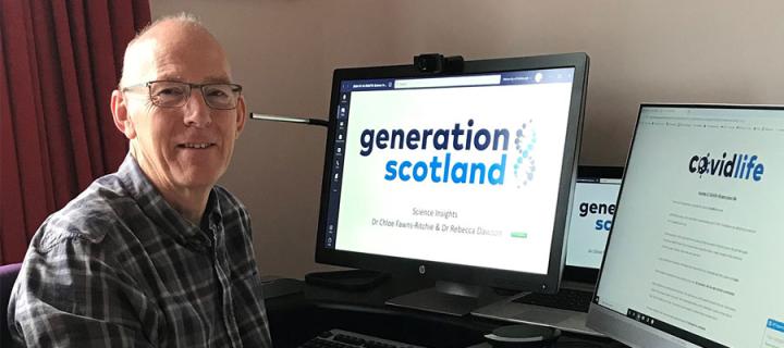 David Porteous sitting in Generation Scotland office
