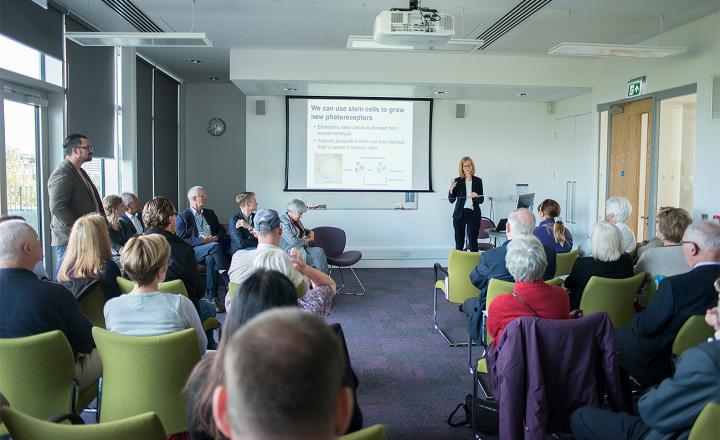 Researchers and clinicians engage with patients as part of the Eye Development & Degeneration event