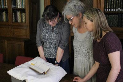 HCA Image of Drs Beattie and Trill viewing Alice Thornton's book in Durham Cathedral