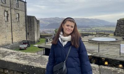 Student Ellie standing near castle