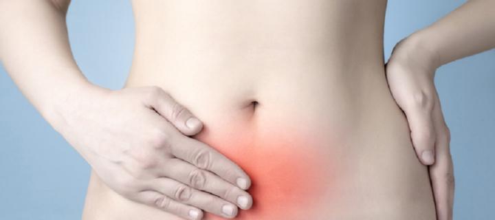 Woman's stomach showing where pain is felt - iStock-537335764 Vonschonertagen