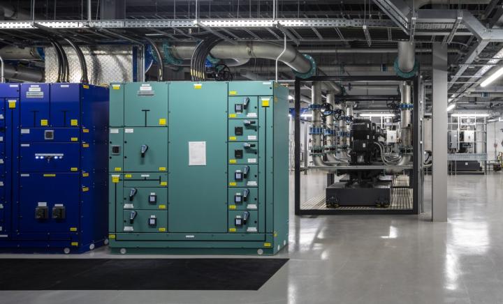 Inside the Supercomputing Facility, showing electrical infrastructure with chilled water circulation pumps in the background
