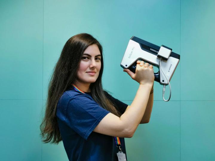 Leyla Deniz-Kiraz uCreate Student Technician holding an Einscan Pro 3D scanner