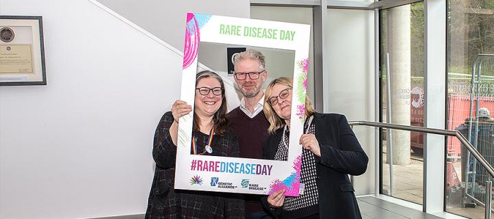 Helen Nickerson, Andrew Jackson and Wendy Bickmore posing with a Rare Disease Day Frame