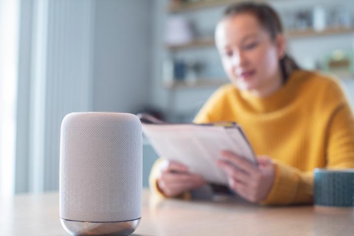 Woman speaks to voice activated assistant