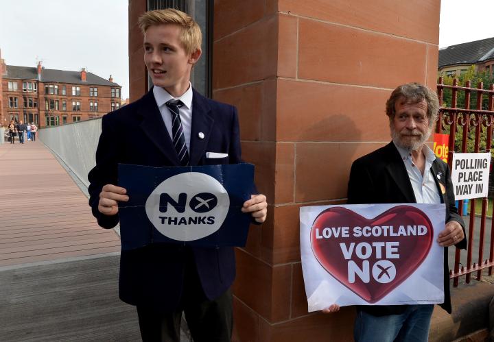 A young campaigner for the No campaign in the Scottish independence referendum outside a polling place 