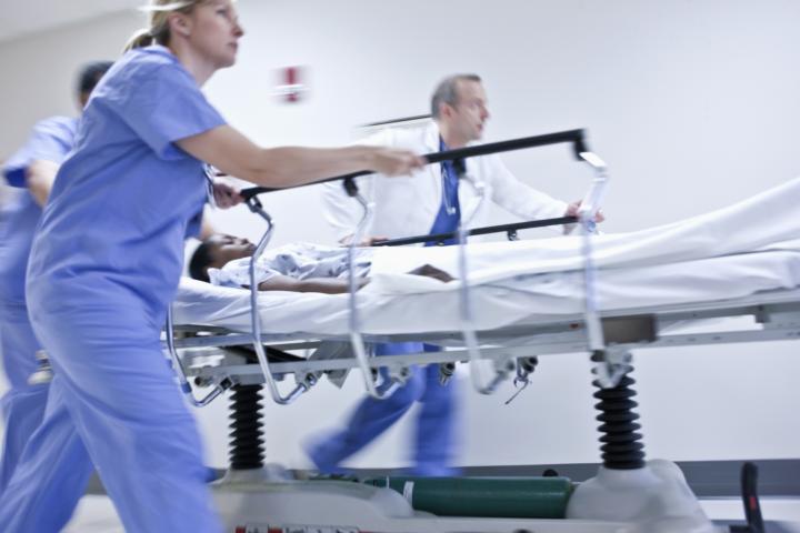 Emergency healthcare staff rush a patient to treatment