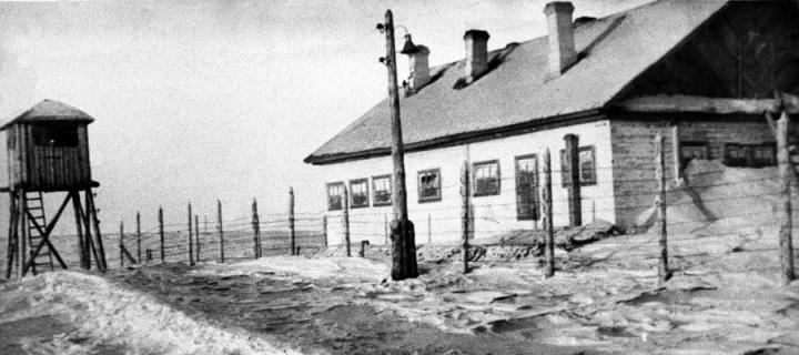 a black and white photo of a Gulag work camp