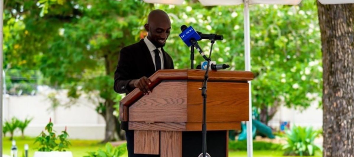 man standing at podium giving a speech