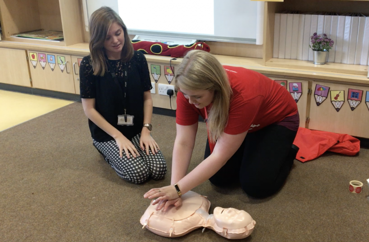 Hannah Costello teaching CPR in a local school