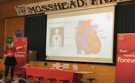 Hannah Costello teaching about heart health in a school