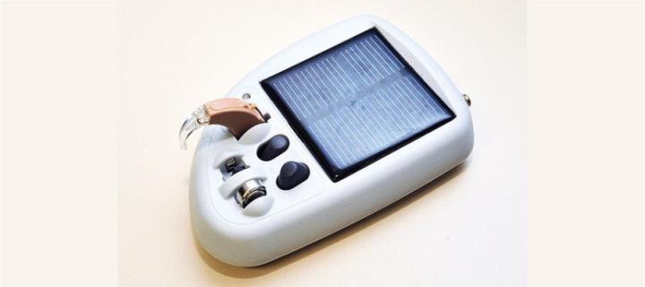 Hearing aid and solar-powered charger
