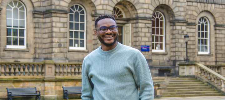 Henry Anumudu stood in Edinburgh's Old College courtyard