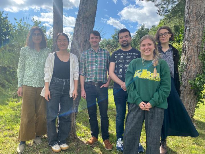 Group photo of six members of the Hetherington standing outside